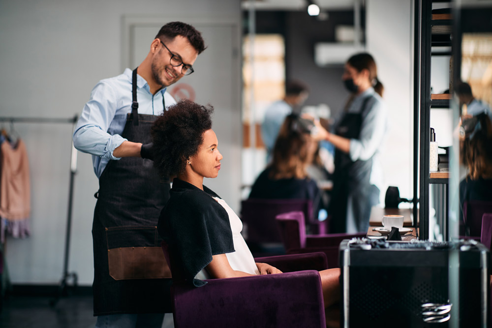 ls_african-american-woman-getting-her-hair-styled-by-2023-02-02-19-32-18-utc